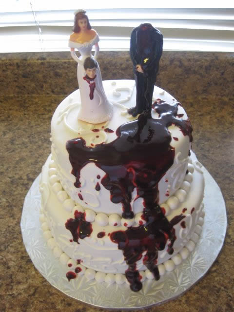 Bride holding husband's head 2 tier divorce cake | riotdaily.com